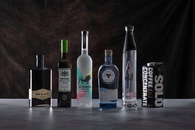 Bottles of Vodka and coffee liqueur on a marble surface. 