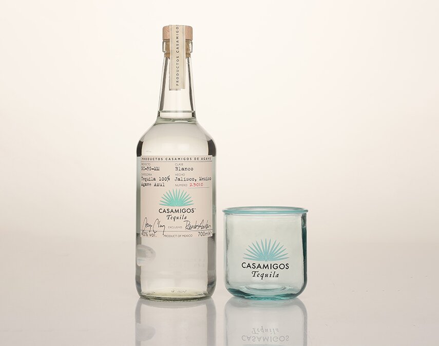 A bottle of Casamigos Blanco Tequila with branded glass