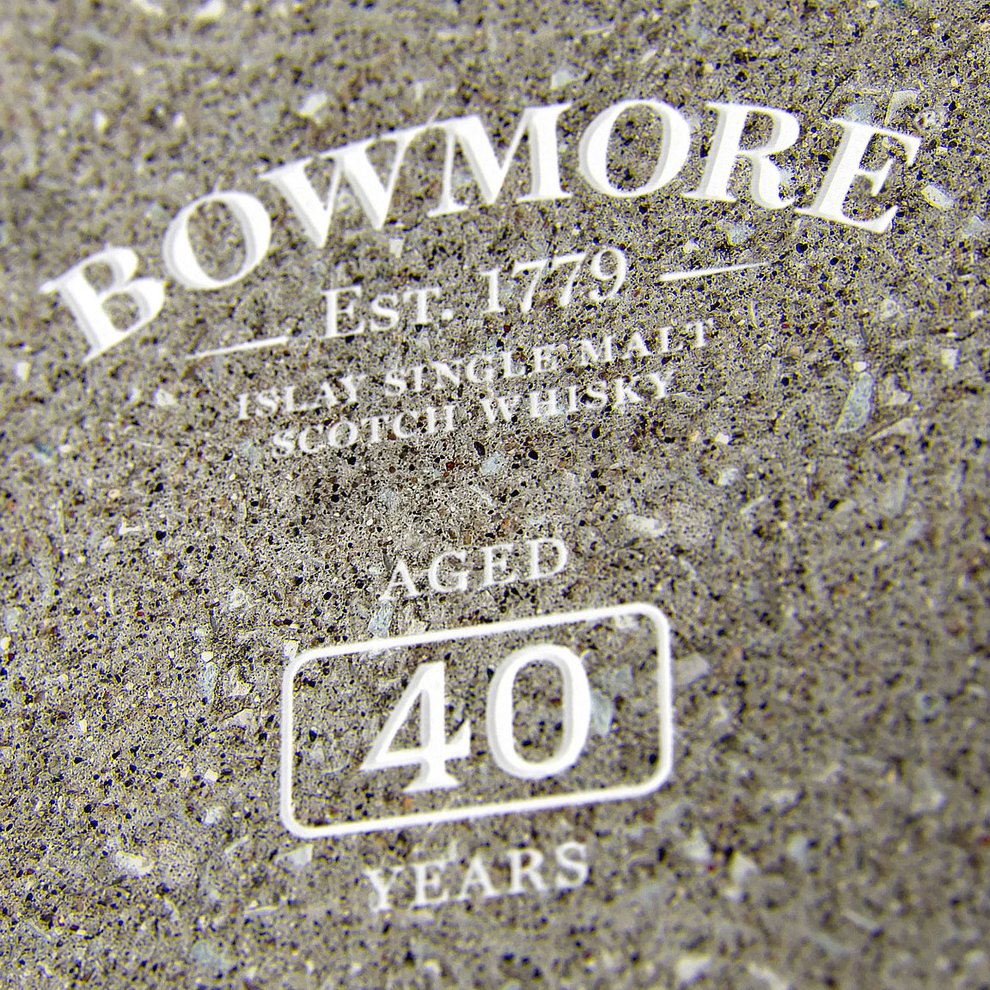 Close-up of whisky presentation box with "Bowmore Aged 40 Years" engaved on it
