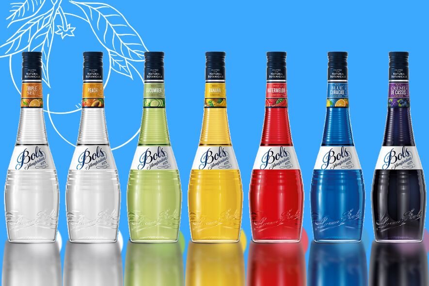 Seven bottles of Bols Liqueur on a blue background.