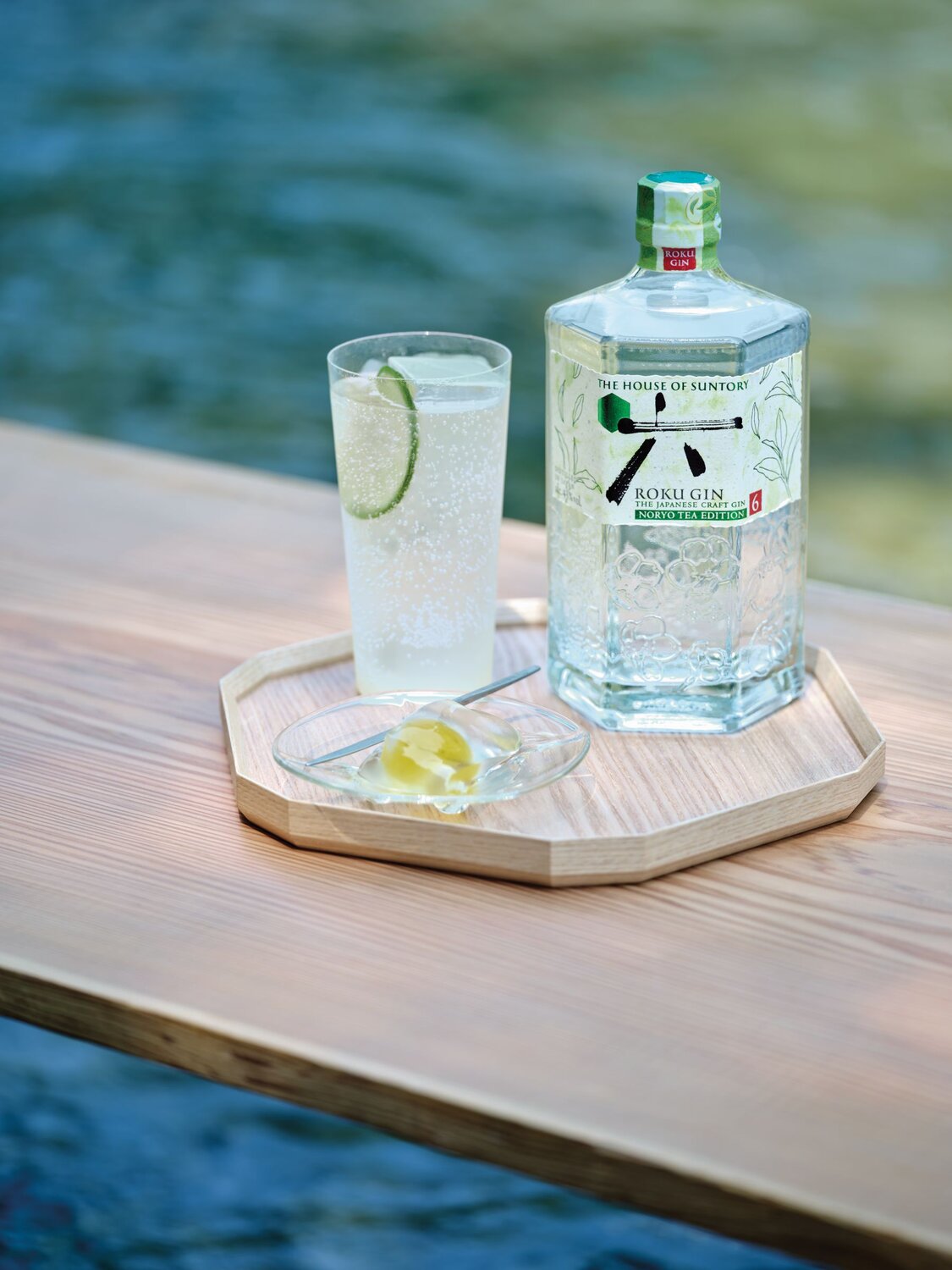 Roku Noryo Fizz cocktail and bottle of Roku Noryo Tea Gin.