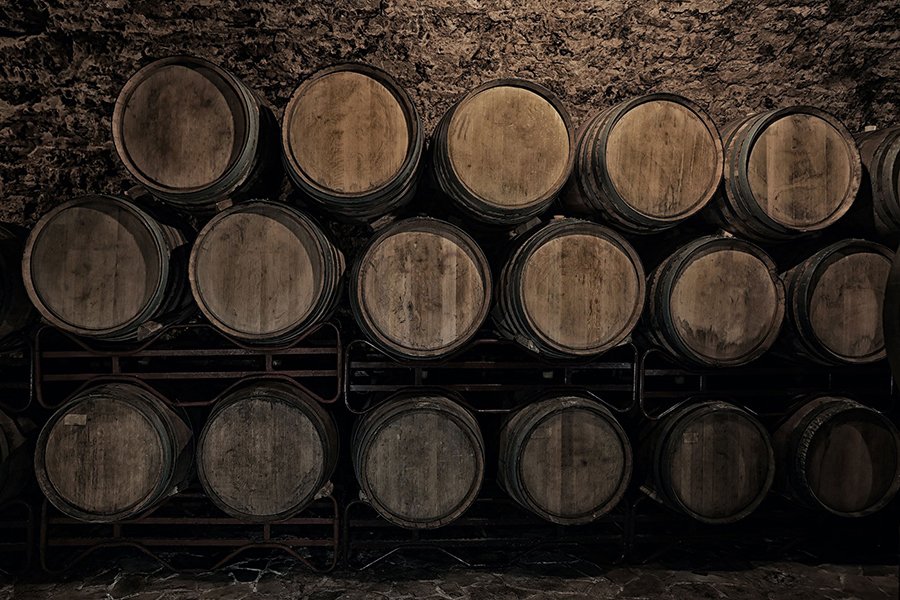 Barrels full of alcohol in a warehouse