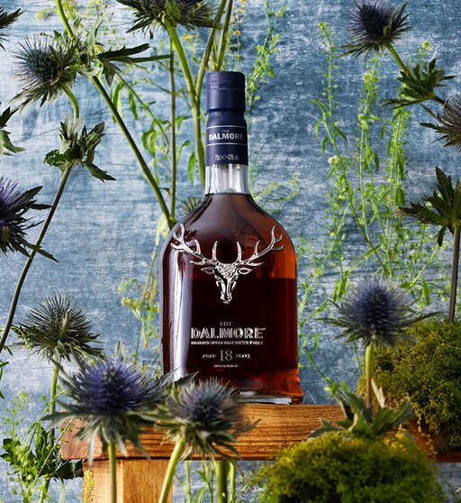 A bottle of Dalmore 18 year old surrounded by thistles. 