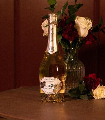 A bottle of Perrier-Jouët Blanc de Blancs Formafantasma