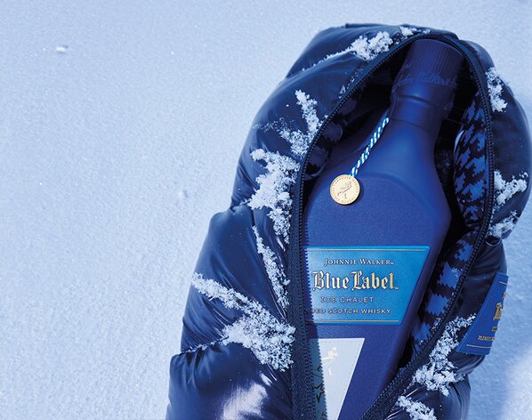 A bottle of Johnnie Walker Blue Label Ice Chalet with it's branded bag.