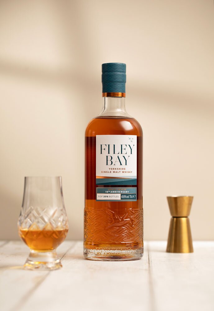 Filey Bay 10th Anniversary Special Release whisky bottle with Glencairn glass and jigger