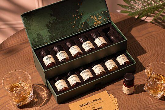 Whisky tasting sets, wax sealed drams and a glass of whisky.