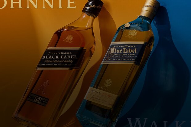 Bottles of Johnnie Walker blue and black label on gold and blue backdrops.