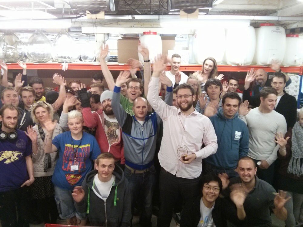 Justin & Master of Malt team waving at warehouse after award win