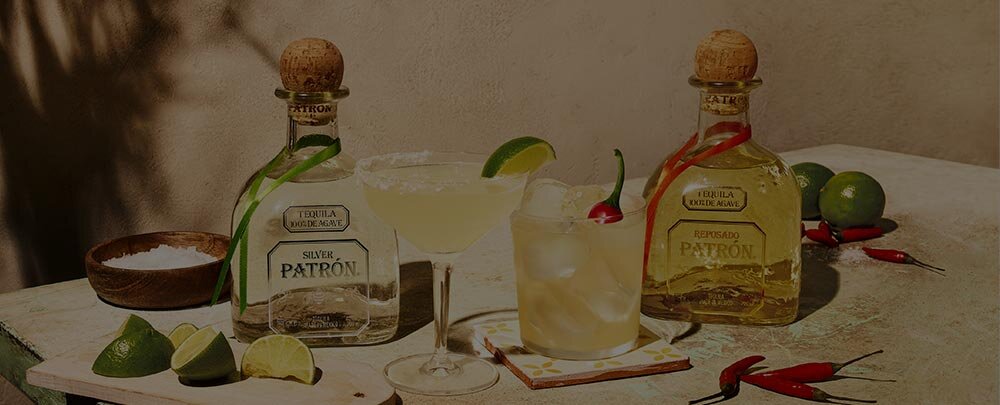 Patron Tequila bottles with cocktails