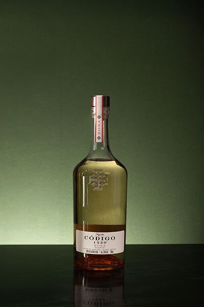 A bottle of Codigo 1530 Rosa Tequila