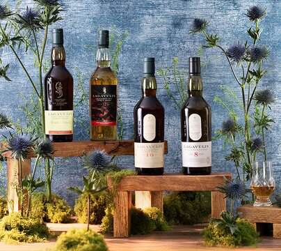 Lagavulin whisky bottles surrounded by thistles