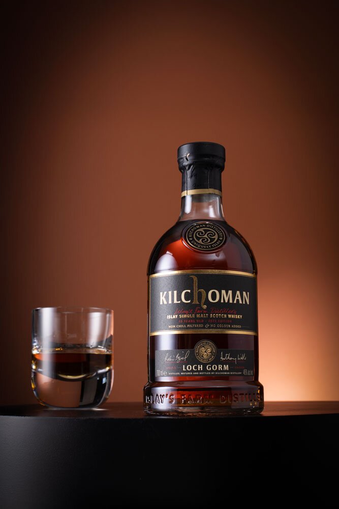 Kilchoman Loch Gorm 2025 Release whisky bottle with glass
