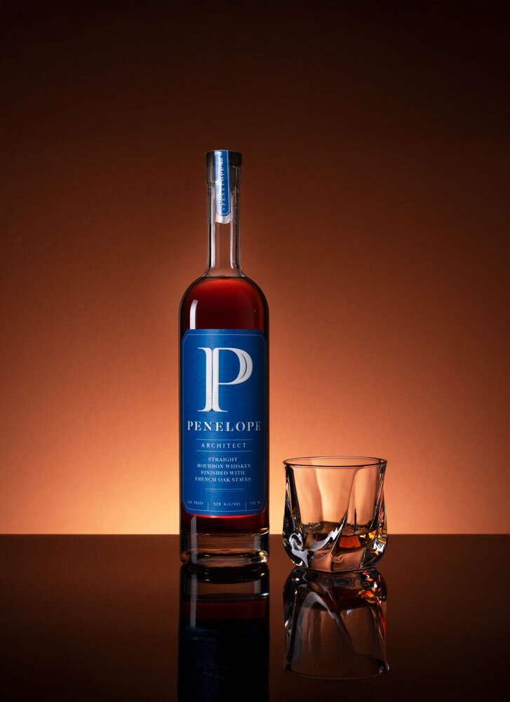 Penelope Architect Straight Bourbon whiskey bottle with glass