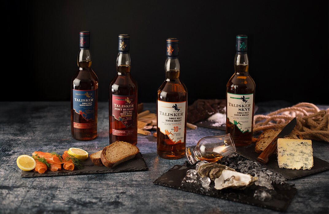 Four bottles of Talisker alongside food pairings