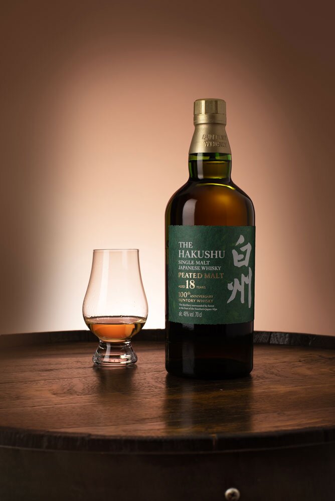 Hakushu 18 Year Old 100th Anniversary whisky bottle and tasting glass