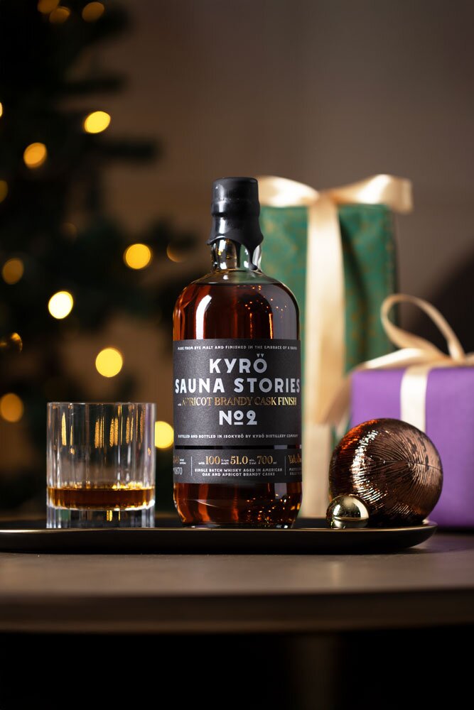 Kyrö Sauna Stories No.2 whisky bottle with Christmas background