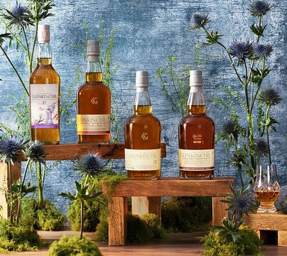 Glenkinchie whisky bottles surrounded by thistles