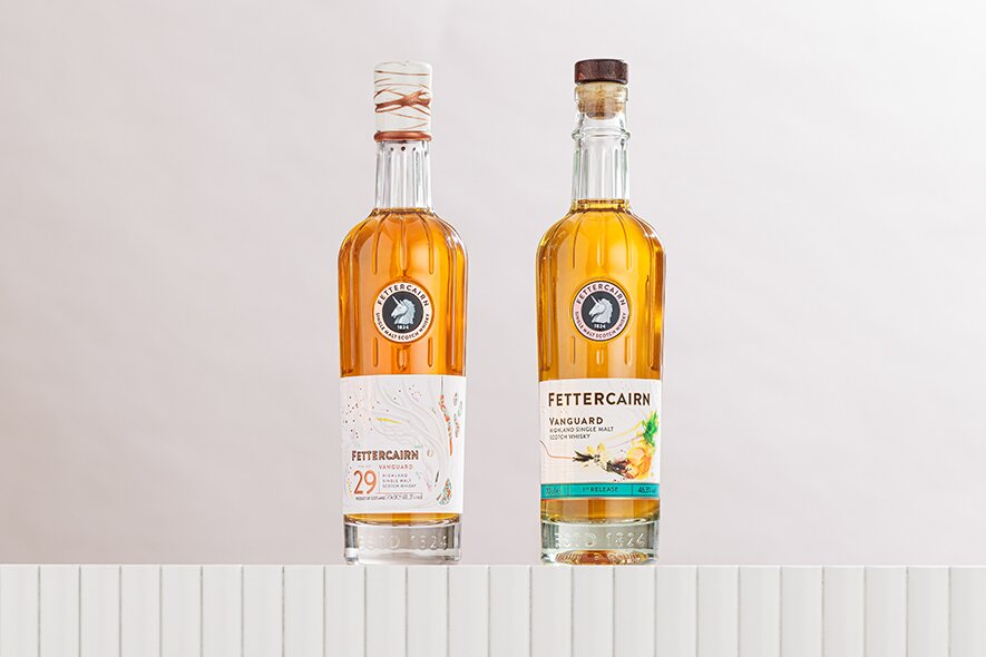 A bottle of Fettercairn Vanguard Collectible 1st Release and Fettercairn Vanguard Rare 1st Release.