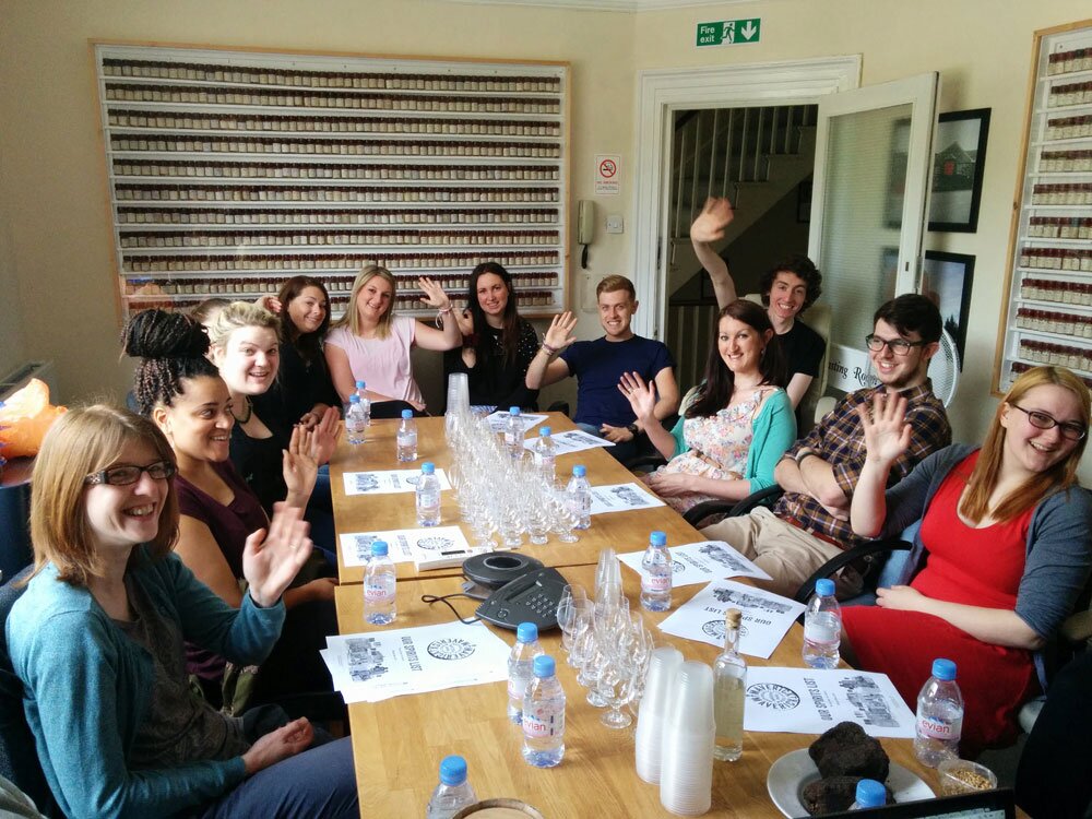 Master of Malt's customer service team waving during a training tasting 2010s