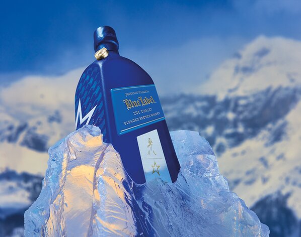 A bottle of Johnnie Walker Blue Label Ice Chalet in ice.