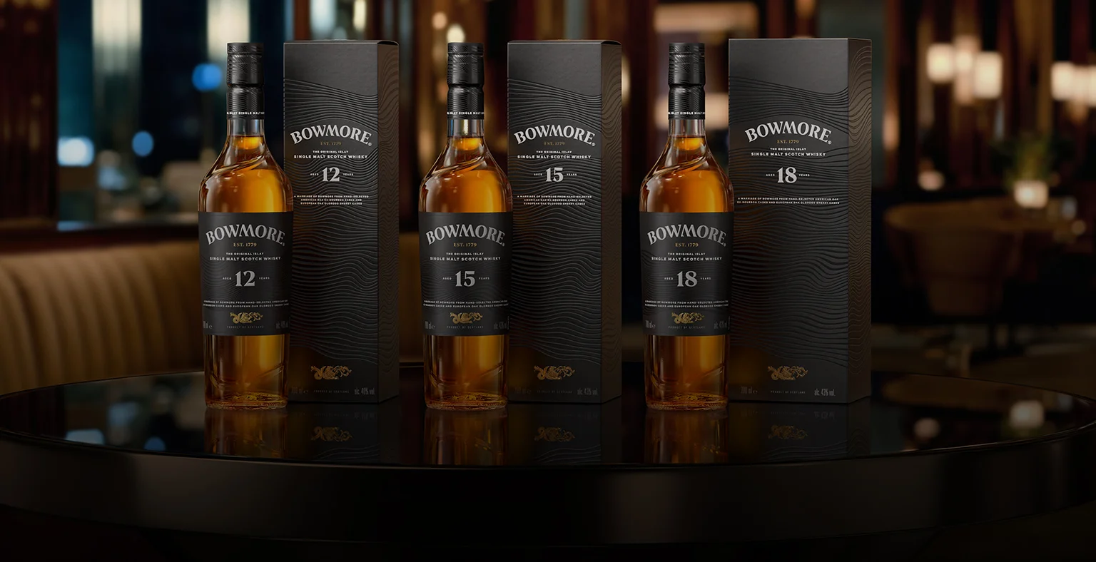 Three bottles of Bowmore Whisky.