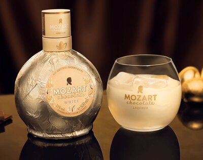 A bottle of Mozart White Chocolate Vanilla Cream Liqueur.