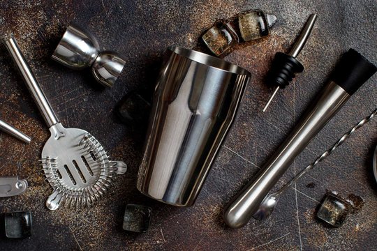 Collection of barware scattered on a table.