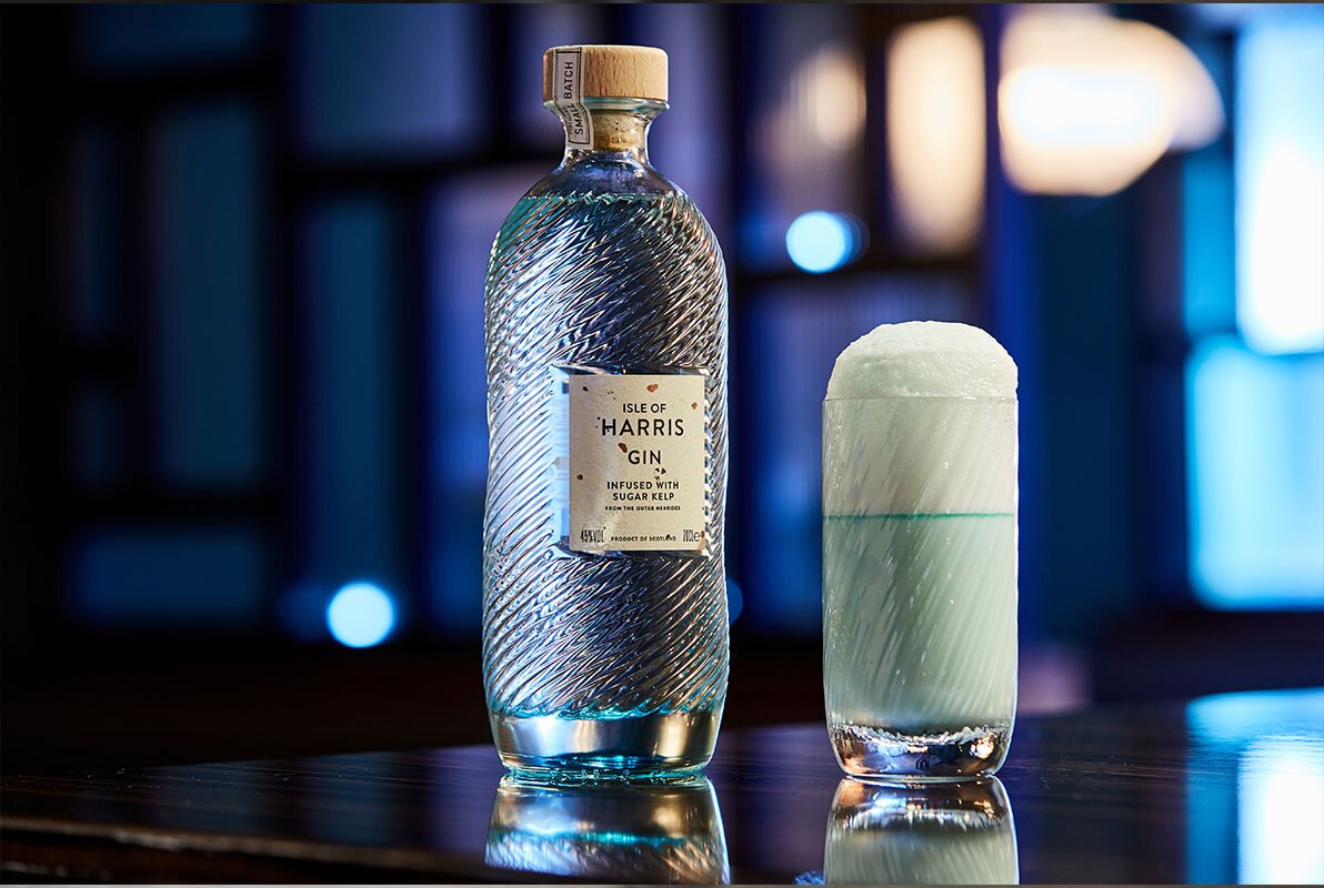 A bottle of Isle of Harris gin with a cocktail.