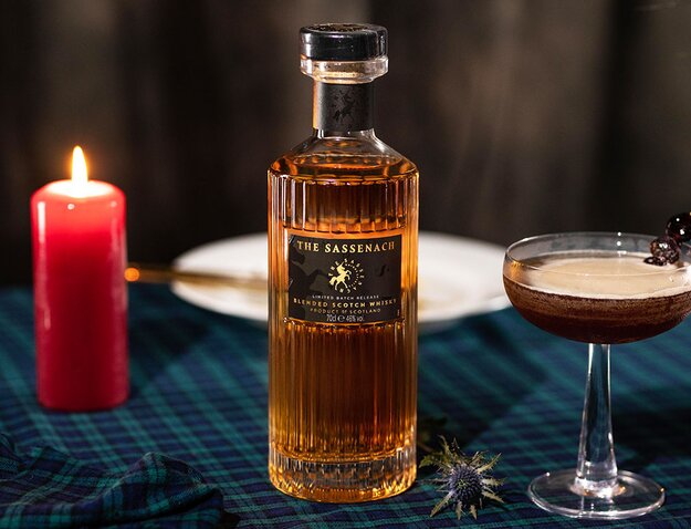 Bottle of Sassenach whisky with a cocktail