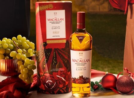 A bottle of The Macallan A Night on Earth in Jerez on a table with food and the presentation box