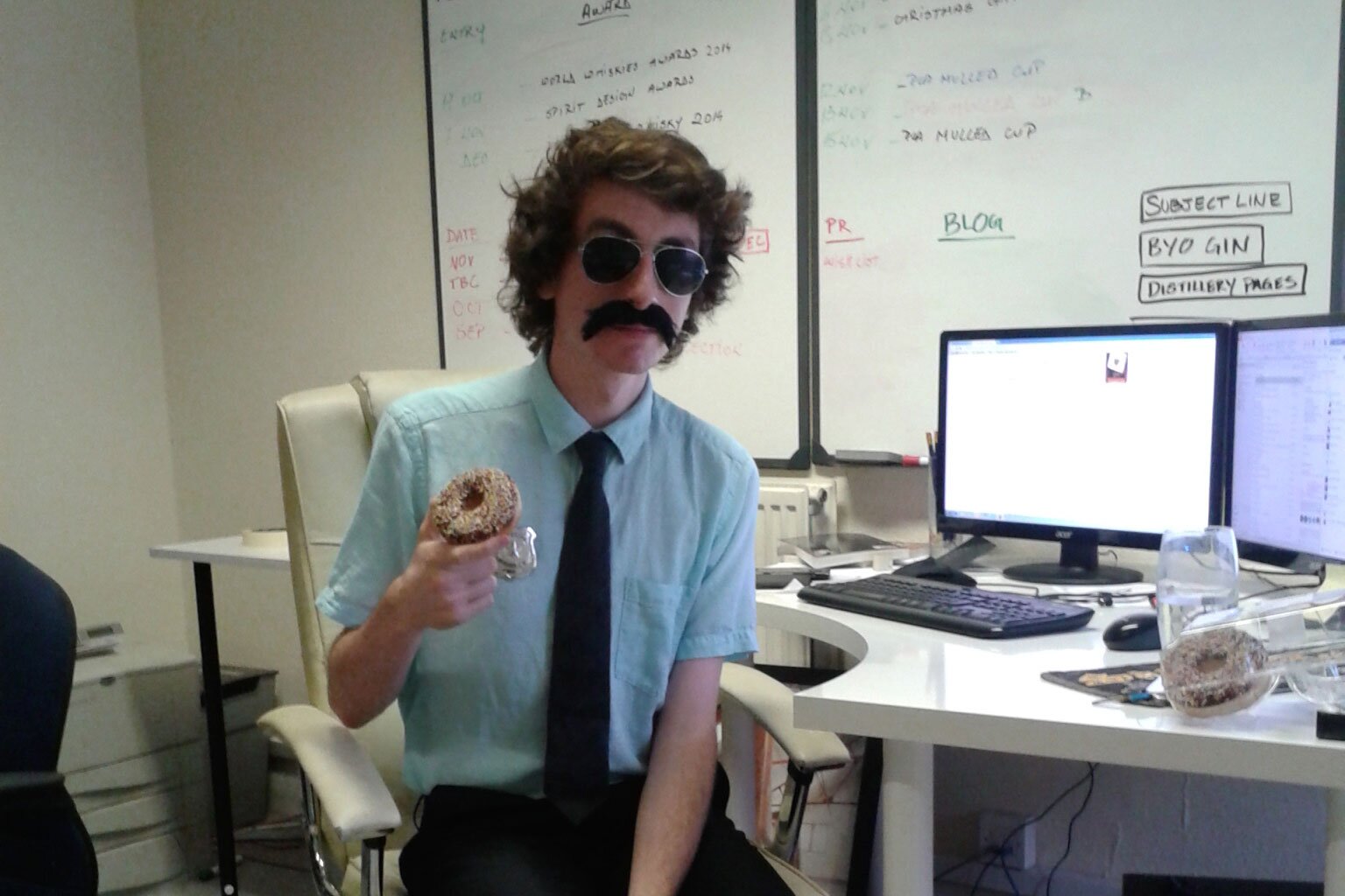 Sam Smith at desk dressed as Beastie Boys Sabotage policeman
