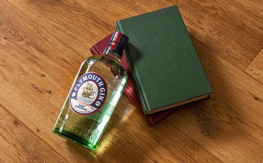 A bottle of Plymouth Gin among some pretty books