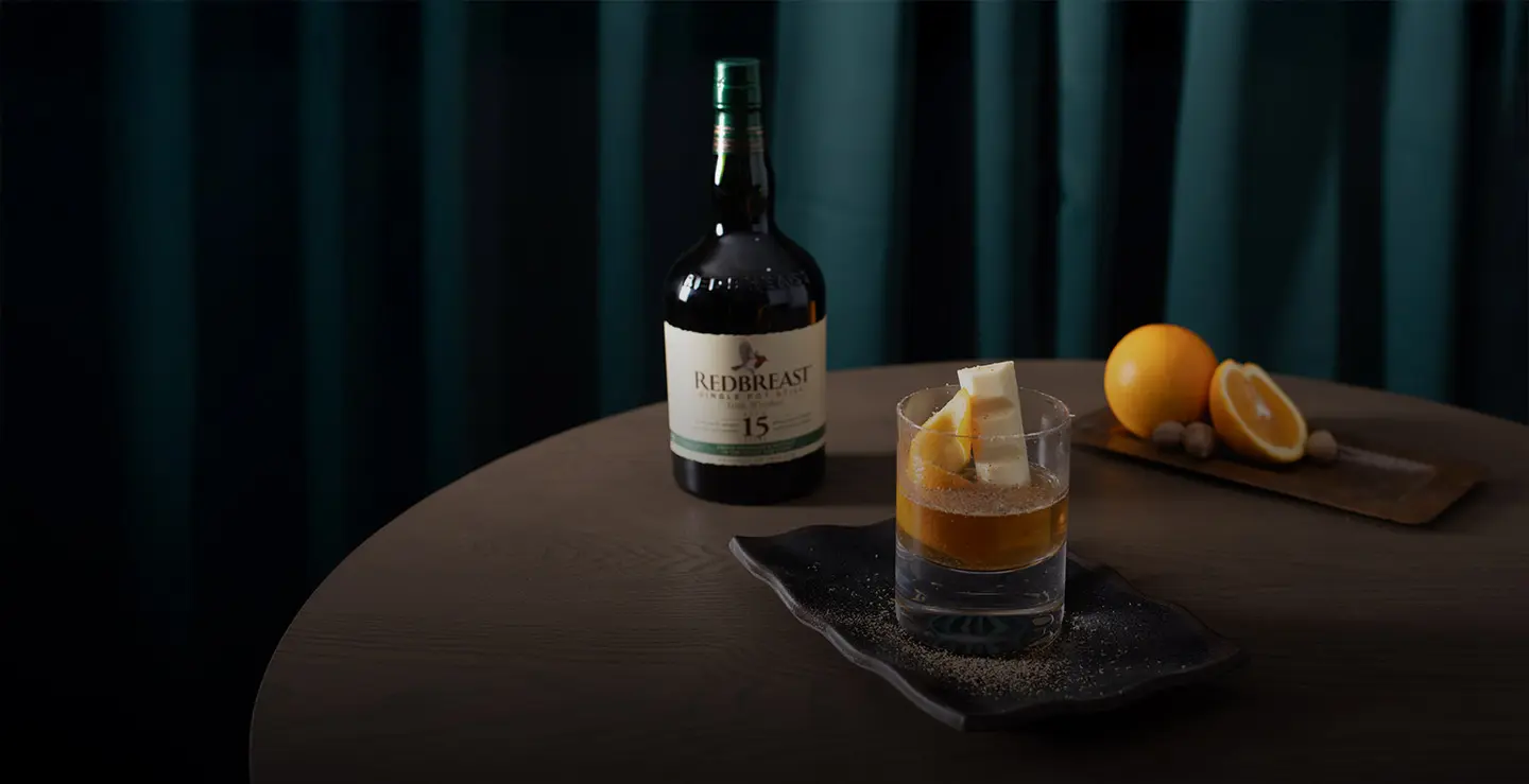 A bottle of Redbreast 15 and cocktail.