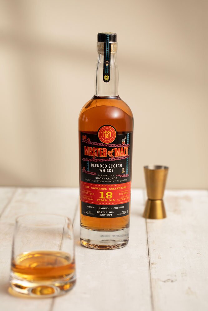 Smoky Blended Scotch Whisky 18 Year Old CaskCade Collection whisky bottle with tumbler glass and jigger