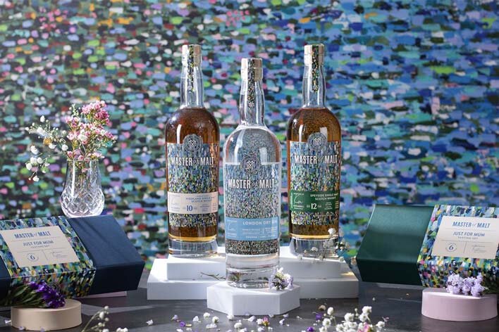 Three bottles of whisky and gin for Mother's Day gifting with tasting sets
