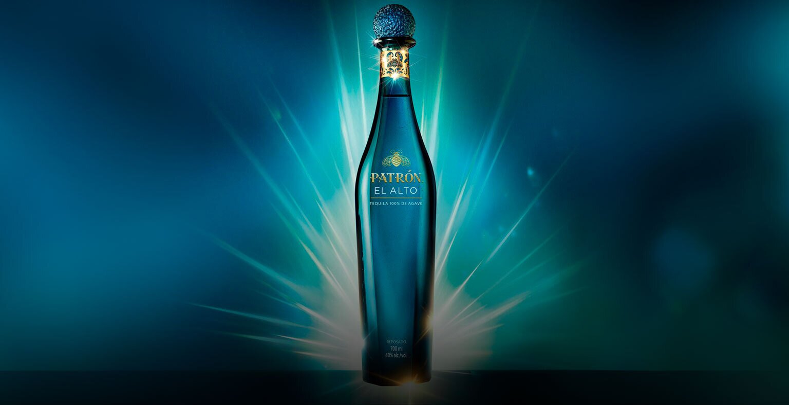 A bottle of Patron El Alto on a blue background.