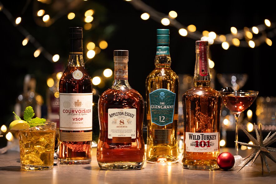 Bottles of Courvoisier VSOP, Appleton Estate 8, Glen Grant 12 and Wild Turkey 101.