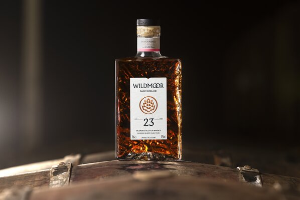 A bottle of Wildmoor 23 on a barrel 
