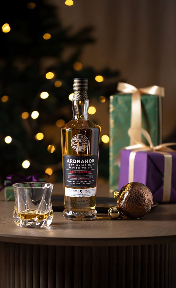 Ardnahoe 5 Year Old Cask Strength whisky bottle with Christmas background