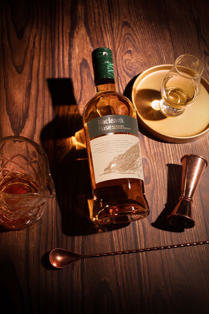 Maclean’s Nose whisky bottle with glass and barware