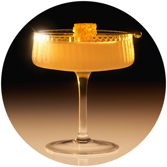 A SirDavis Honey Bee Cocktail in a coupe glass. 