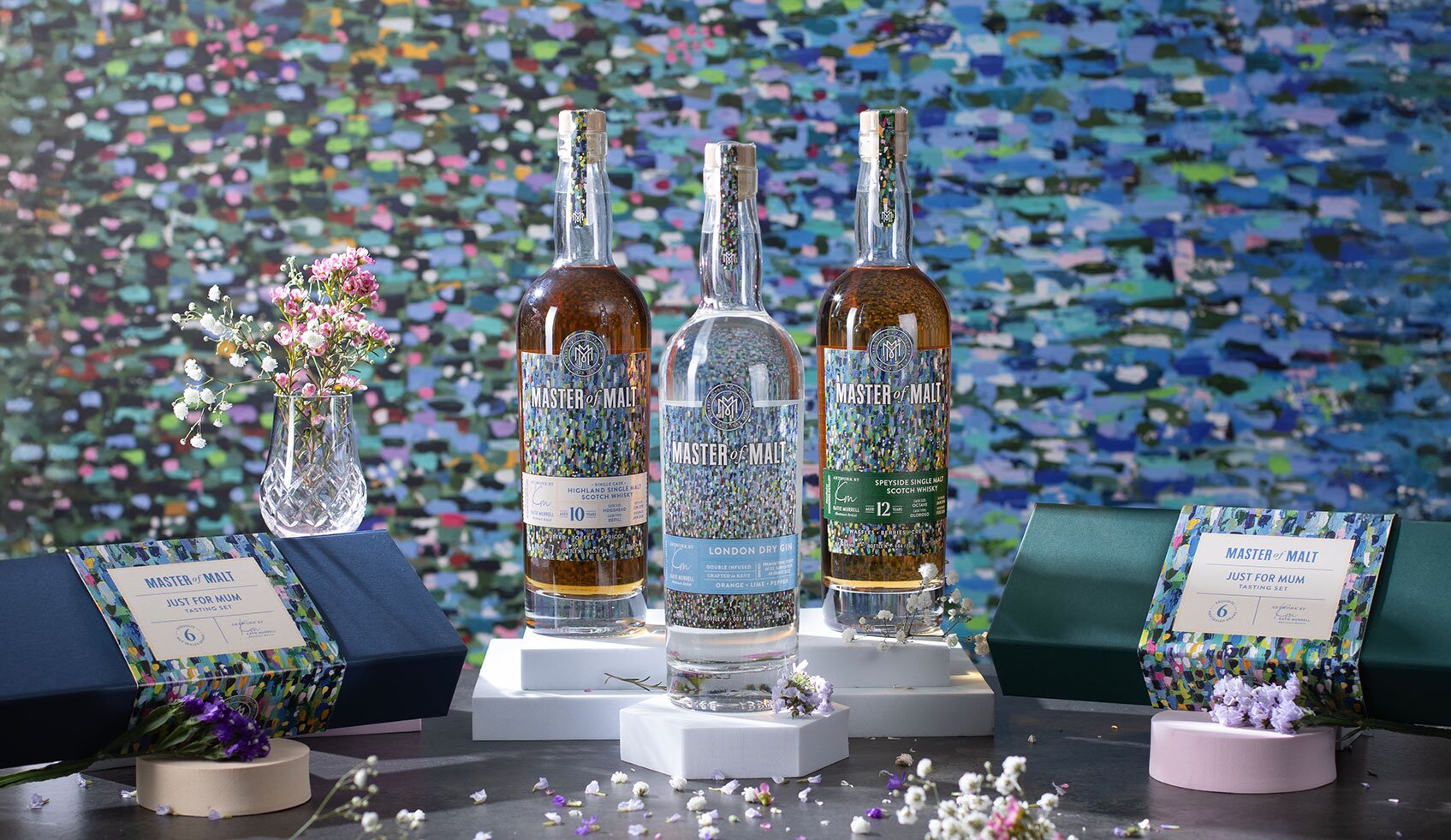 Three bottles of whisky and gin for Mother's Day gifting with tasting sets