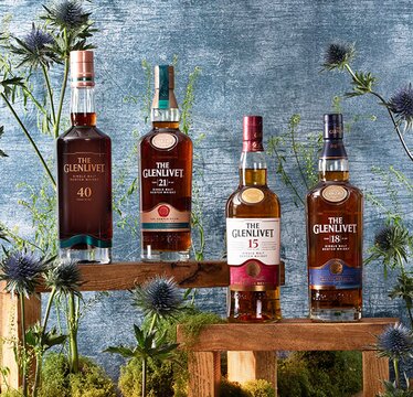 Glenlivet whisky bottles surrounded by thistles