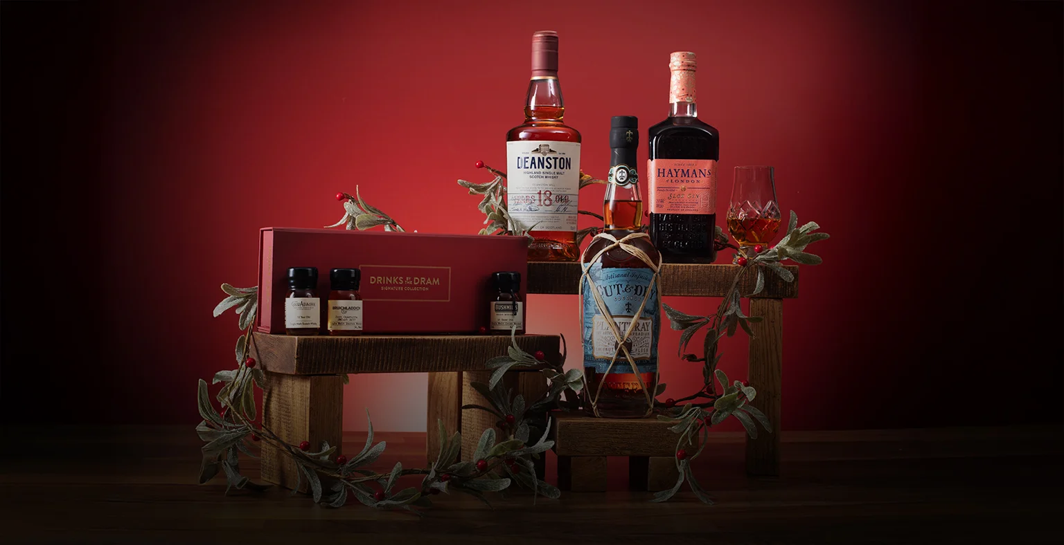 A range of bottles on a green Christmas background