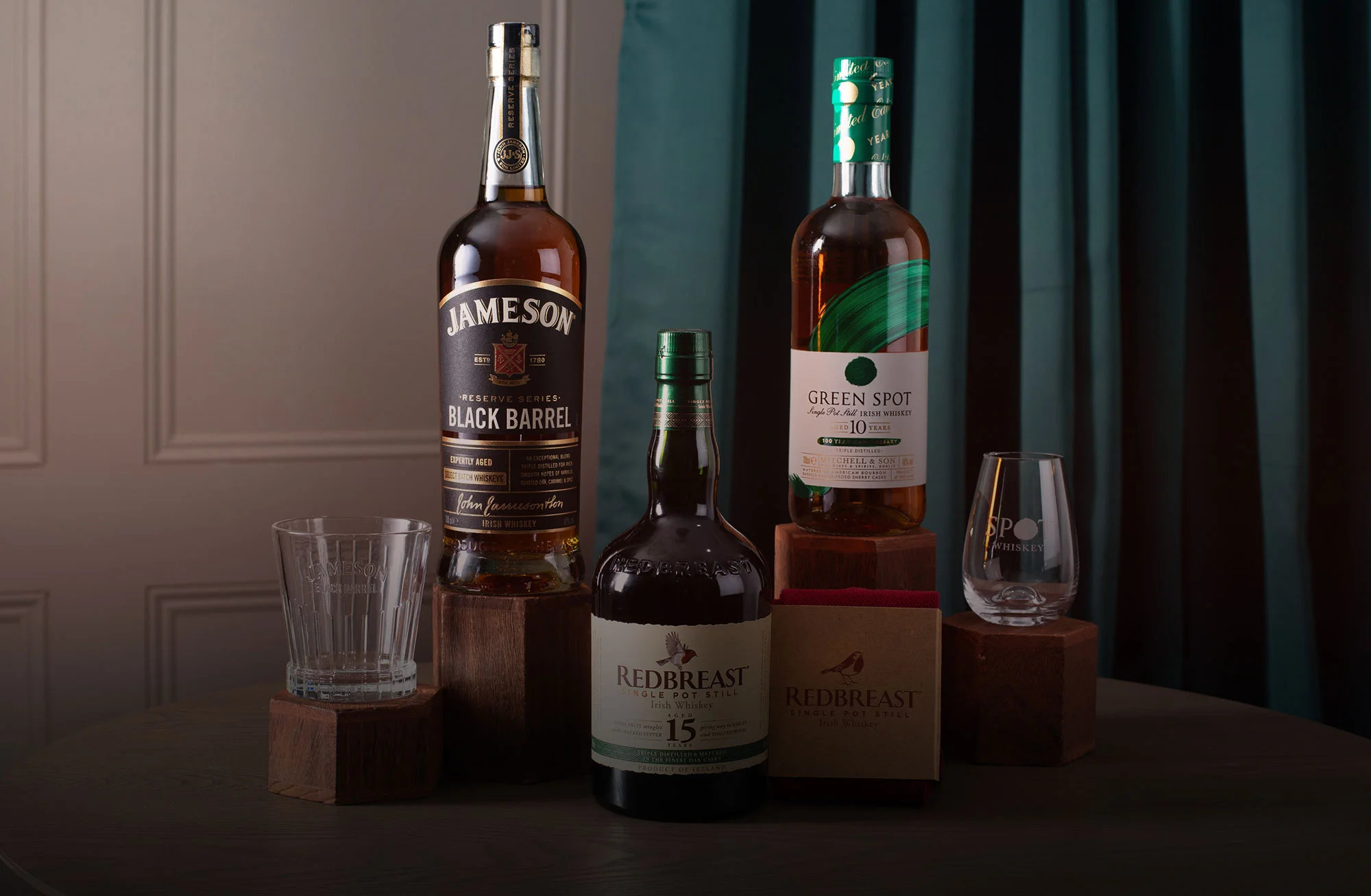 A bottle of Green Spot, Redbeast 15 and Jamesons Black Barrell Irish Whiskey.