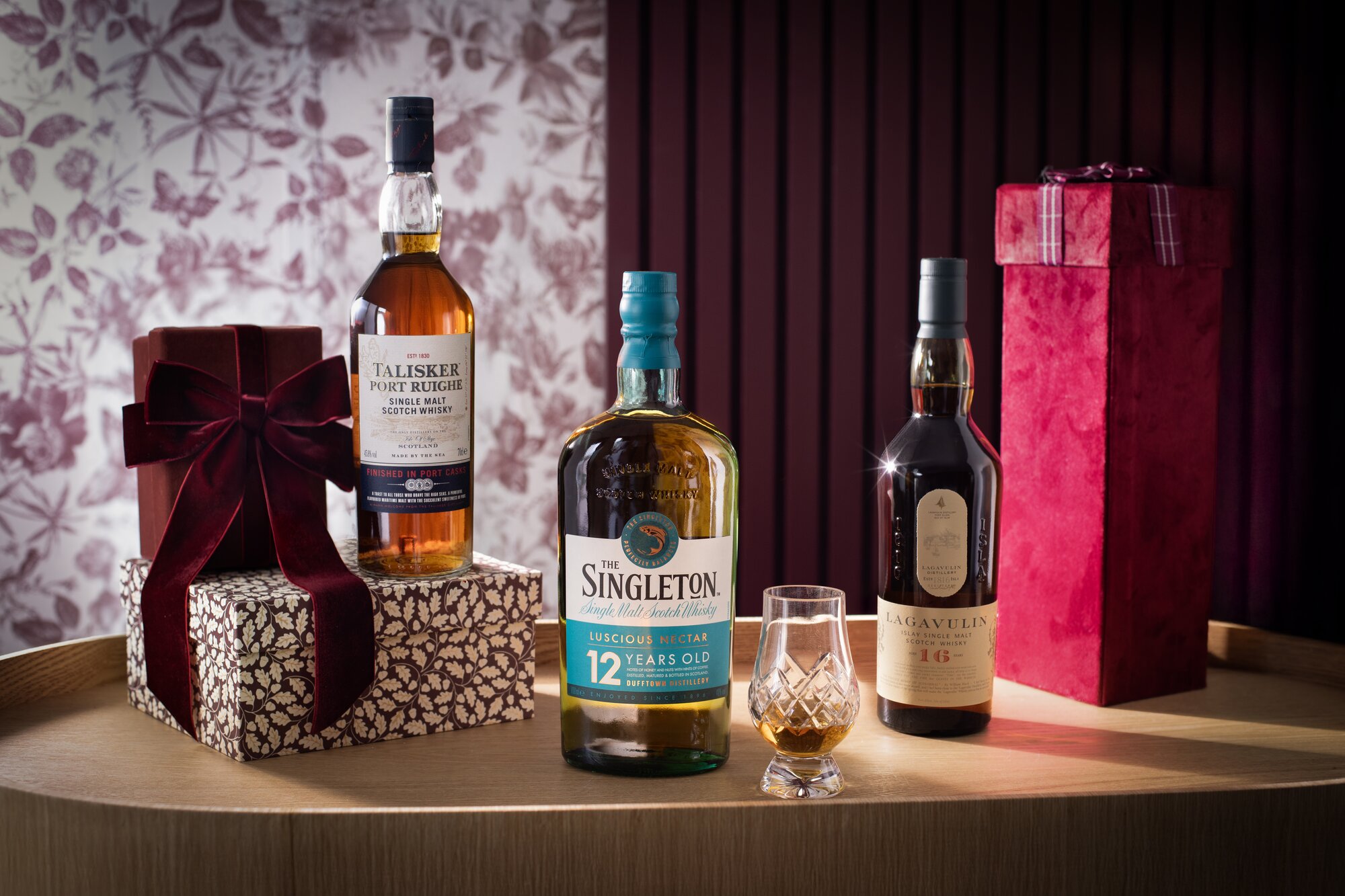 A bottle of talisker, singleton and lagavulin whisky 