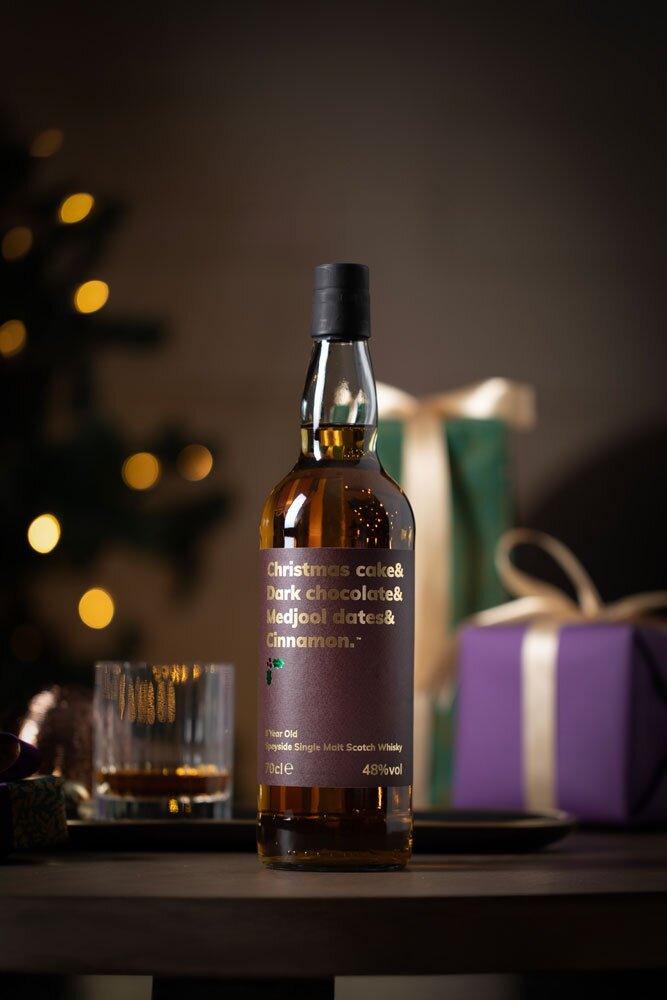 Christmas Cake & Dark Chocolate & Medjool Dates & Cinnamon 8Year Old whisky bottle with Christmas background