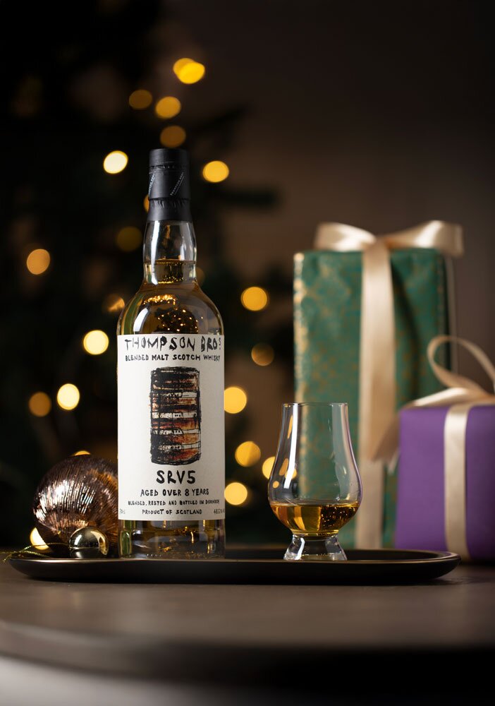 SRV5 8 Year Old Thompson Bros. whisky bottle with Christmas background