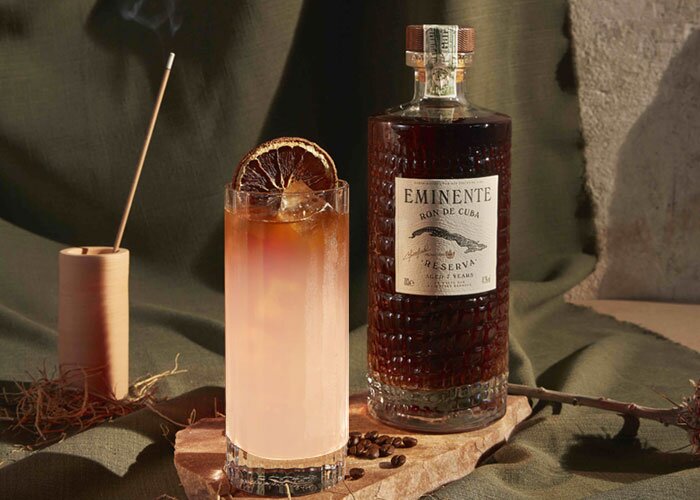 A bottle of Eminente Reserva 7 Year Old and cuban mule cocktial.